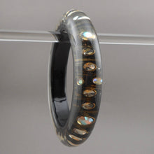 Load image into Gallery viewer, Vintage 1980s Lucite Bangle Bracelet with Iridescent Rhinestones - Clear, Black and Metallic Gold Acrylic Resin - Embedded Aurora Borealis AB Crystal Stones