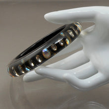 Load image into Gallery viewer, Vintage 1980s Lucite Bangle Bracelet with Iridescent Rhinestones - Clear, Black and Metallic Gold Acrylic Resin - Embedded Aurora Borealis AB Crystal Stones
