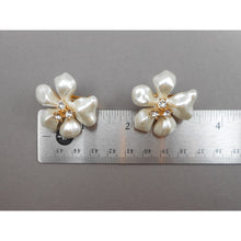 Load image into Gallery viewer, Vintage Kenneth J Lane KJL Earrings - White Faux Mother of Pearl Plastic Flowers with Crystals - Gold Tone Clip On