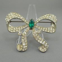 Load image into Gallery viewer, Large Vintage Art Deco Era Bow Brooch Pin - Clear and Green Faux Emerald Rhinestones Paste - Silver Pot Metal Ribbon Setting