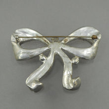 Load image into Gallery viewer, Large Vintage Art Deco Era Bow Brooch Pin - Clear and Green Faux Emerald Rhinestones Paste - Silver Pot Metal Ribbon Setting
