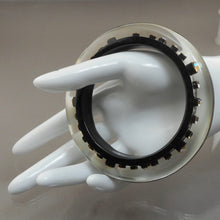 Load image into Gallery viewer, Vintage 1980s Lucite Bangle Bracelet with Iridescent Rhinestones - Clear, Black and Metallic Gold Acrylic Resin - Embedded Aurora Borealis AB Crystal Stones