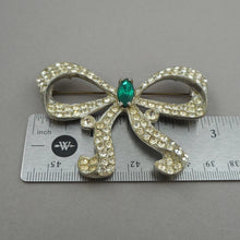 Load image into Gallery viewer, Large Vintage Art Deco Era Bow Brooch Pin - Clear and Green Faux Emerald Rhinestones Paste - Silver Pot Metal Ribbon Setting