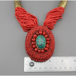 Bajalia Kanalai Indian Glass Seed Bead Necklace - Brass Horns, Faux Coral and Turquoise Pendant - Multi Strand Statement Piece with Cording and Stamped Metal