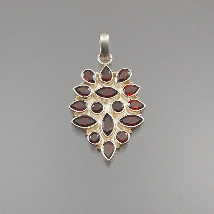 A vintage multi stone red garnet and sterling silver pendant. Natural gemstones, bezel set, handmade. FREE Shipping to US locations