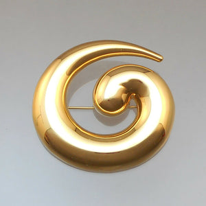 A large scale vintage gold tone statement brooch. Signed designer pin by Monet in a Modernist design. Works well as a scarf holder too. Approximately 2 1/4" x 2 1/8". Excellent vintage pre-owned condition. Barely, if ever, worn. FREE Shipping to US locations