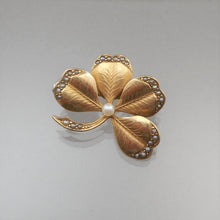Load image into Gallery viewer, An antique Victorian good luck shamrock pin / pendant. Tiny seed pearls are set in 10k yellow gold (acid tested, unmarked), an Irish themed four leaf clover design. FREE Shipping to US locations