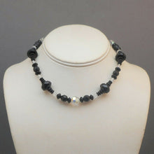 Load image into Gallery viewer, An Art Deco Era necklace of French jet (black glass) and aurora borealis beads. Choker length with opaque and iridescent round, bicone and faceted disc beads.  Beads vary from approx 5 - 12mm, necklace length is 14 1/2&quot;  Very nice vintage pre-owned condition commensurate with age and use.  FREE Shipping to US locations