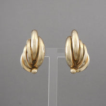Load image into Gallery viewer, This is a circa 1950 pair of clip earrings by Bergere (L. Erbert &amp; Pohls Inc.), New York, NY. Gold tone, feather shaped design. Vintage pre-owned condition with minor finish loss and a small dent on one of the earrings. FREE US Shipping via USPS standard shipping