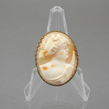 Load image into Gallery viewer, Vintage or antique carved shell cameo brooch in a gold finish setting. Victorian Revival style in a delicate filigree frame.  Approximately 1 3/8&quot; x 1 5/8&quot;.  Vintage pre-owned condition FREE Shipping to US locations