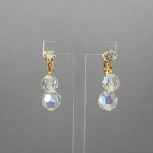 Load image into Gallery viewer, A circa 1950 pair of clip on dangle earrings with clear aurora borealis (AB) clear glass beads and gold tone settings.  Each approximately 1/2&quot; X 7/8&quot;  Excellent vintage pre-owned condition.  FREE Shipping via USPS standard shipping to Continental US locations