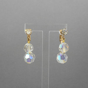 A circa 1950 pair of clip on dangle earrings with clear aurora borealis (AB) clear glass beads and gold tone settings.  Each approximately 1/2" X 7/8"  Excellent vintage pre-owned condition.  FREE Shipping via USPS standard shipping to Continental US locations