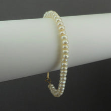 Load image into Gallery viewer, This is a vintage cultured button pearl bracelet with a 10K gold clasp Pearls approximately 5 - 6 mm Bracelet length approximately 7 1/2&quot; Excellent vintage pre-owned condition. FREE Shipping via USPS standard shipping to Continental US locations