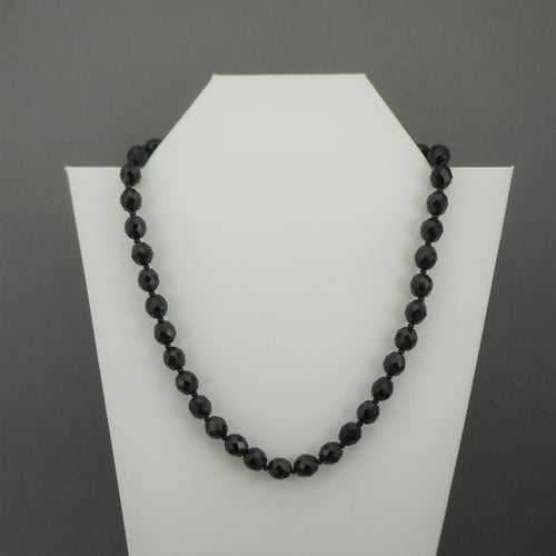 A vintage single strand necklace of French jet (black glass) beads. Collar length with faceted round and seed beads.  Approximately 18 1/2