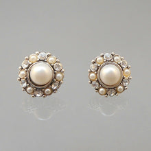 Load image into Gallery viewer, Vintage clip on earrings, silver tone, for pierced ears. Circa 1980 with rhinestones and round faux pearls.  Each approximately 5/8&quot; diameter.  Excellent vintage pre-owned condition.  All rhinestones are in place and still bright and clear. FREE US Shipping
