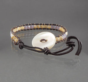 Unisex Leather and Opalescent Stone Bead Bracelet. In the style of Chan Luu, maker unknown, adjustable leather and stone bead friendship bracelet. The bracelet is in excellent vintage pre-owned condition, the button is chipped on the underside FREE Shipping via USPS standard shipping to Continental US locations